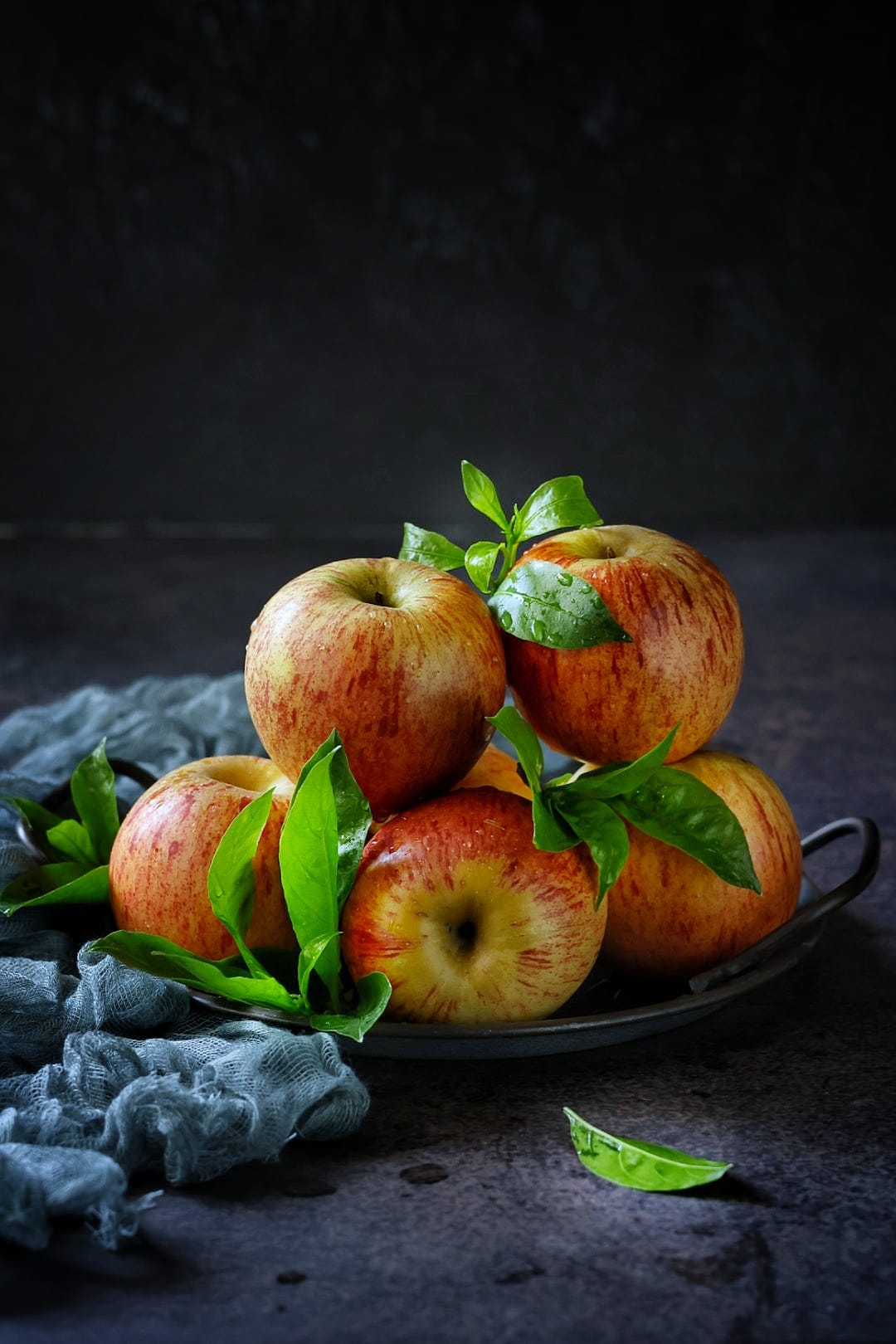 Red apples on a plate